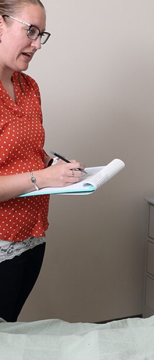 registered nursing students and instructor working in a lab