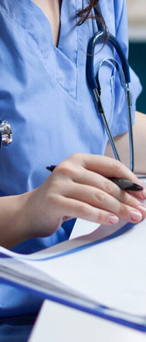 medical professional looking over documents